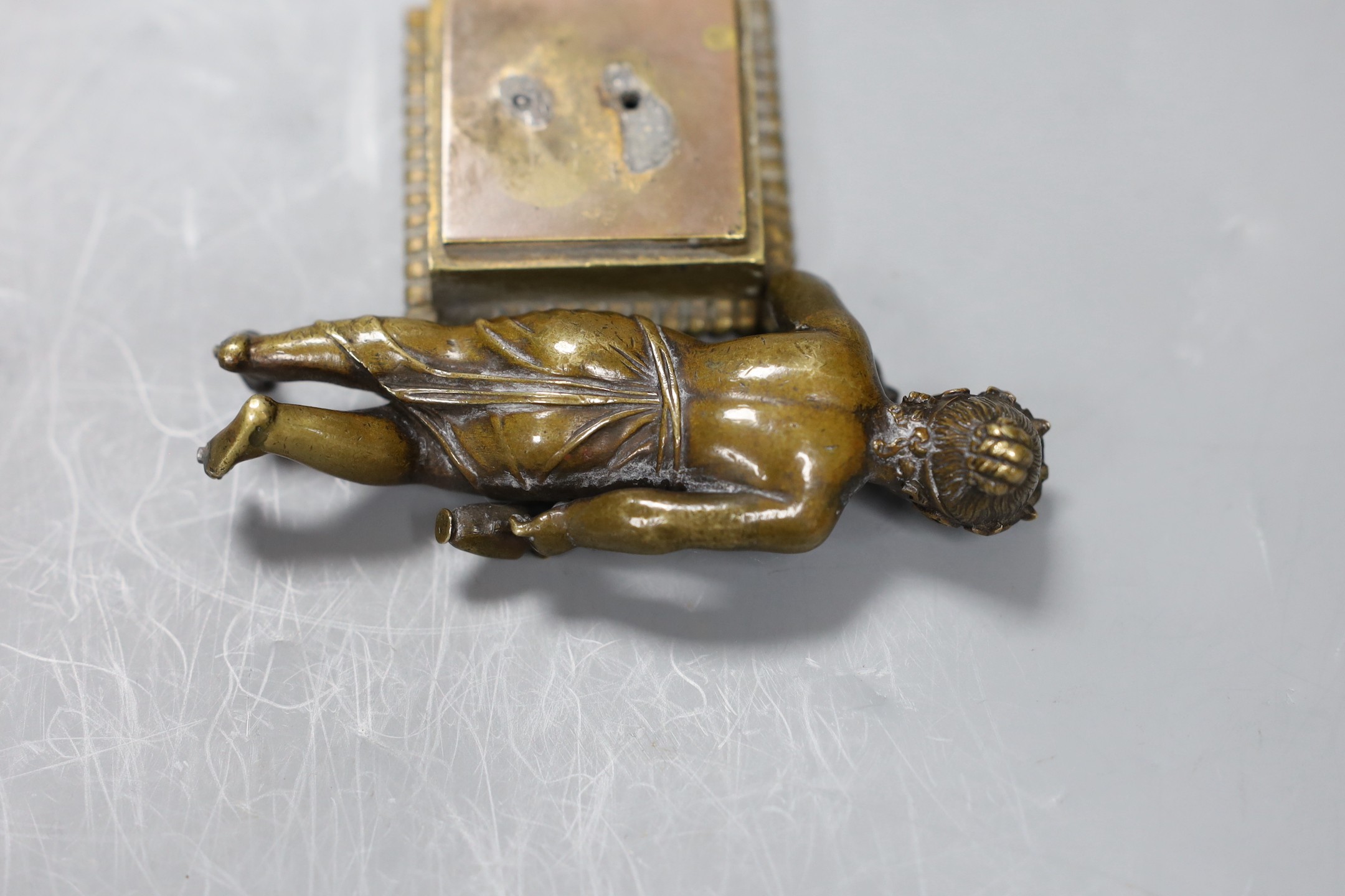 A 19th century Grand Tour souvenir bronze figure a Bacchanlian putti, 9cms high